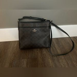 Dark brown signature Coach crossbody bag